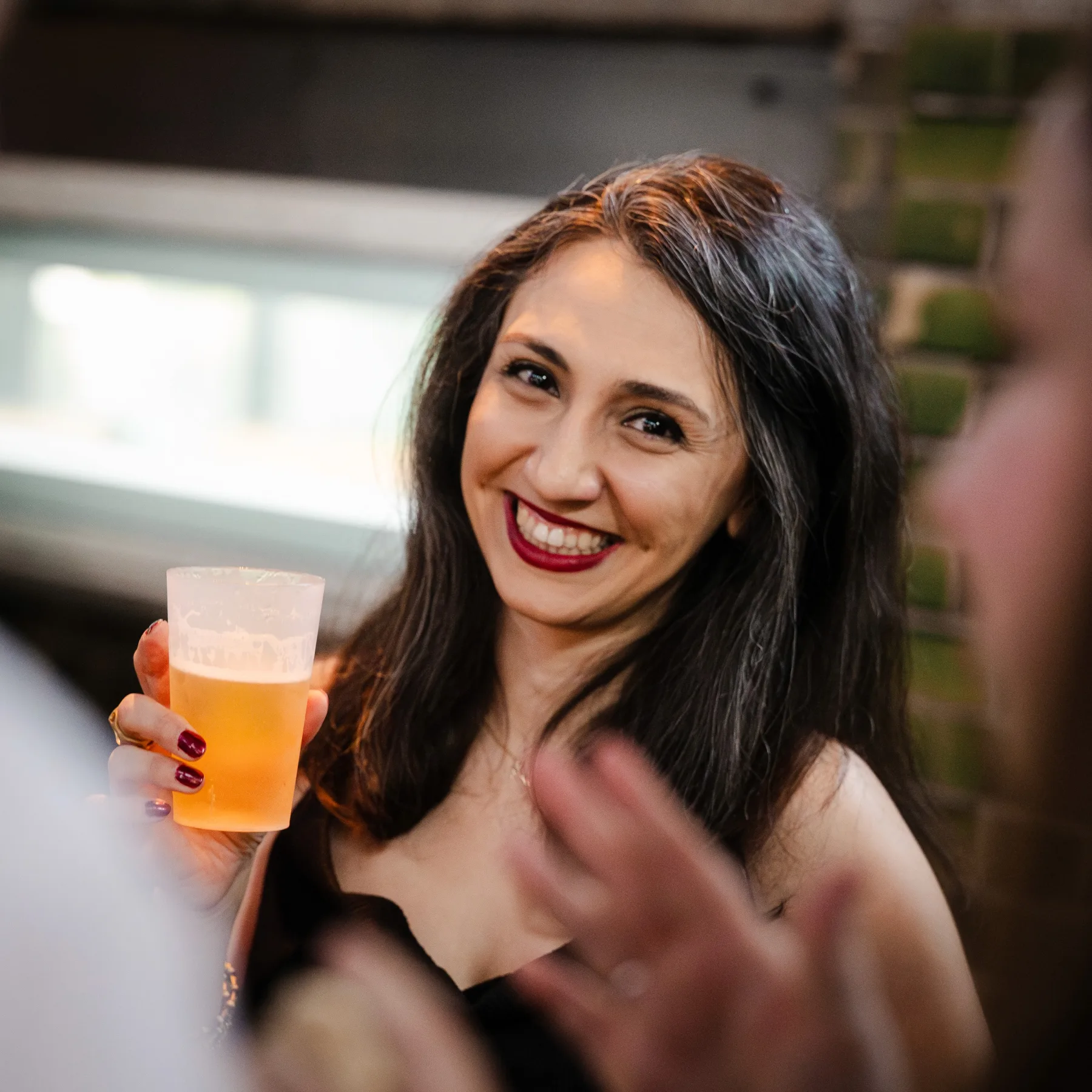 Maryam Javadian smiling at a social gathering
